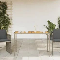 vidaXL Tuintafel met acaciahouten blad 115x54x74 cm poly rattan grijs