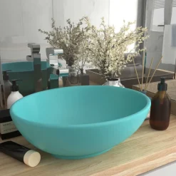 vidaXL Wastafel ovaal 40x33 cm keramiek mat lichtgroen